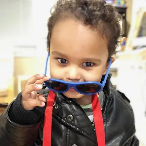 a boy with sunglasses